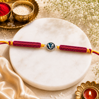 Om Enamel Rakhi in 925 Sterling Silver with Pink Braided Thread