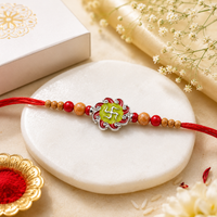 Swastik Enamel Rakhi in 925 Sterling Silver with Red Thread & Beads
